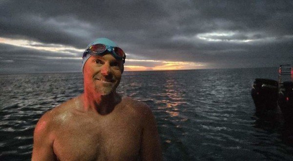 World record swimmer braves cold, unpredictable waters to raise funds for animals