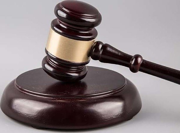 Two remanded over robbery and unlawful possession of militar...